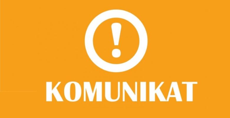 Grafika z napisem komunikat.